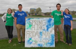 Spring Fling organizers, from left, Alisa Herr, Brad Seiger, Nick Kirk and Hannah Willig, pose with the sign.