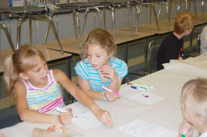 Girls doing arts and crafts