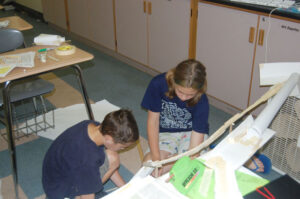 Kids construct a dinosaur