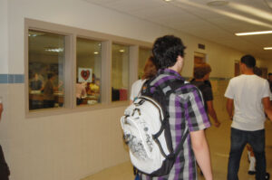 kid with a backpack in the hall