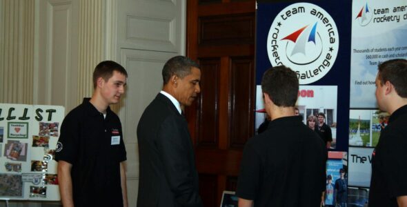 President Obama talks with PM team members