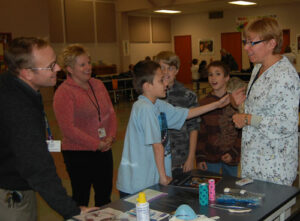 students with a veterinarian