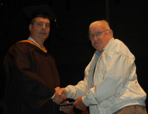 special graduate, Mr. Philip Fisher, a Korean War veteran who received his diploma