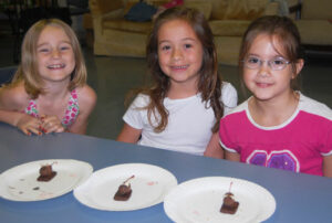 edible mice using a Hershey's Kiss, chocolate covered cherry, and almonds
