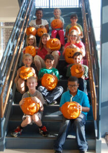 Students and their carved pumpkins