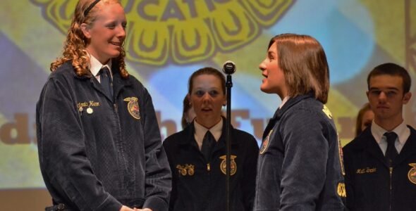 Victoria Herr, left, is installed as the new Pennsylvania FFA State Secretary by Deidra Bollinger of Elizabethtown, who previously held the position. (Allison Hoover photo)