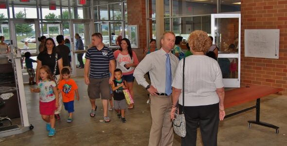 Hambright principal Jerry Egan speaks with visitors during orientation.