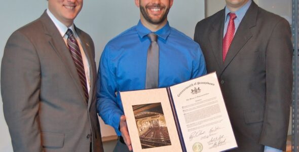 State Reps. Ryan Aument, left, and Bryan Cutler present Nick Crowther with a citation from the PA Legislature on Crowther's technology-education teaching award.