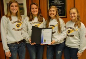 Senior playersdisplay the commendation.