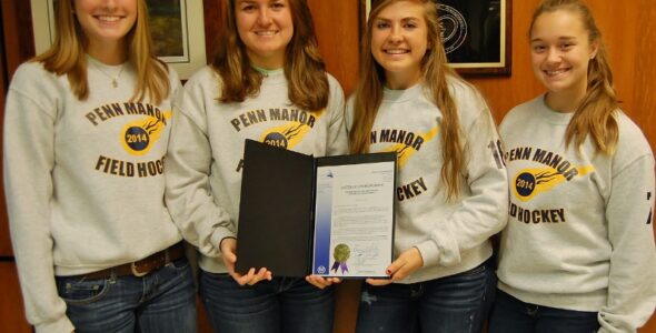 Senior playersdisplay the commendation.