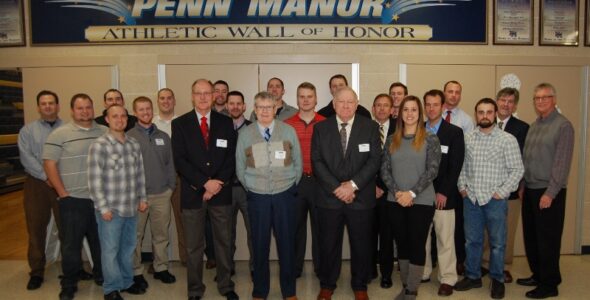 Inductees into the Penn Manor Athletic Wall of Honor are, front row, from left, Bill Walton, Jim Amigh, Ralph E. Byers and Lauren Schaefer. Behind them are members of the 2005 Penn Manor baseball team.