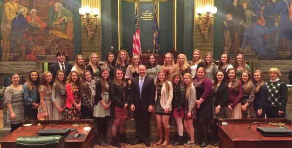 State Sen. Lloyd Smucker with coaches and members of the Comets field hockey team on the Senate floor.