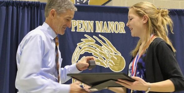 Penn Manor Athletic Director Jeff Roth gives Emily Mackey her ring