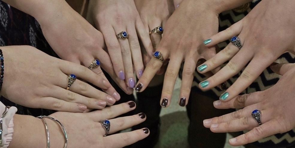 Hands from the team with their rings