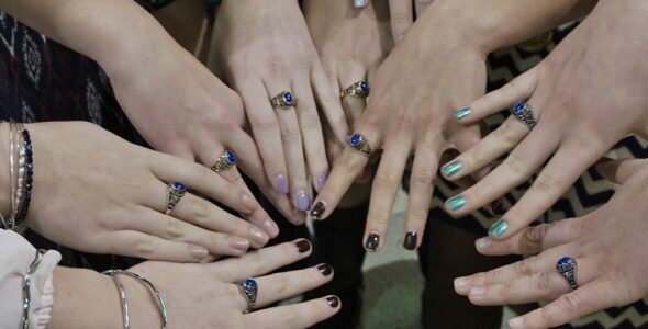 Hands of the girls team with their rings