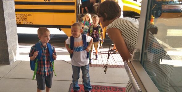 Teacher Beth Titus helps a boy get where he needs to go.