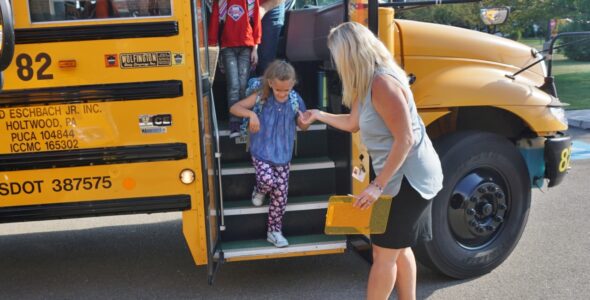 Martic principal Dr. Sugra lends a helping hand.