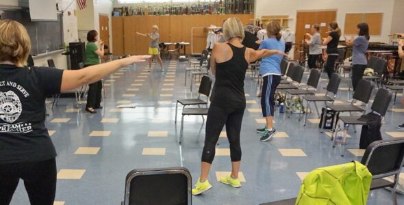 Participants practice qigong.