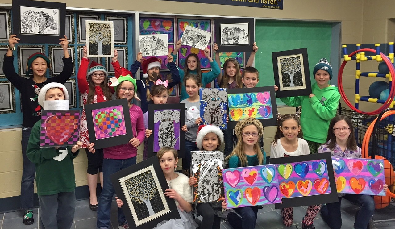 Central Manor students holding their artwork that will be displayed in city gallery