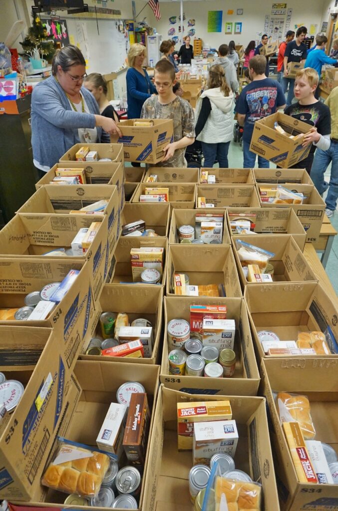 Food boxes are packed at the high school.