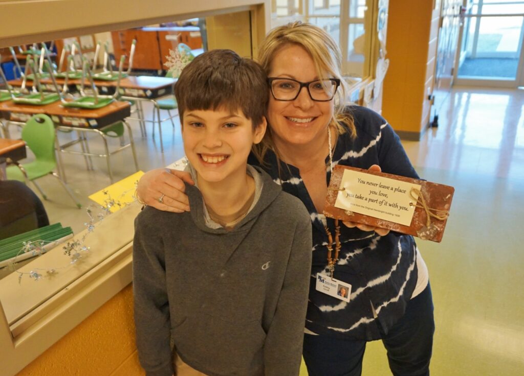 Student and teacher with brick