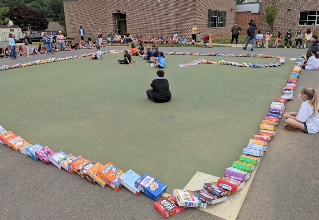 Conestoga hosts cereal box domino event to benefit local food banks