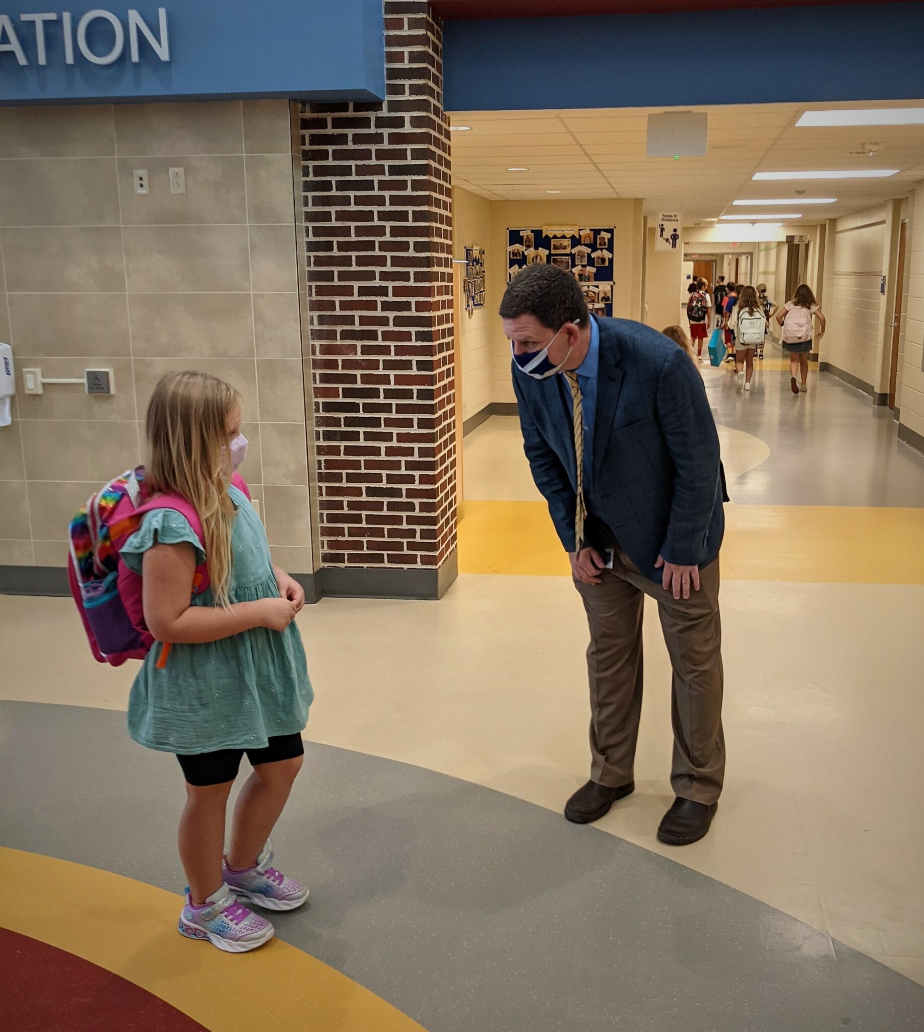 Principal Scott Keddie with a student at Conestoga Elementary