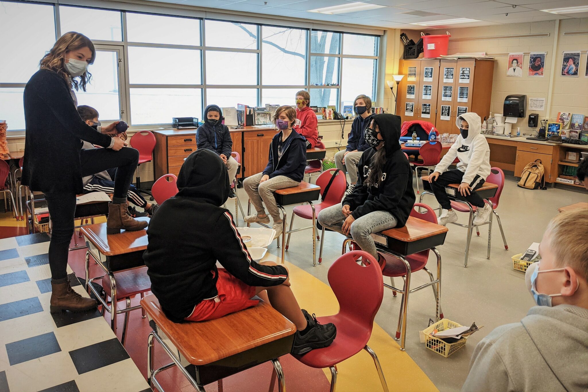 Mrs. Raff talks with students in her classroom