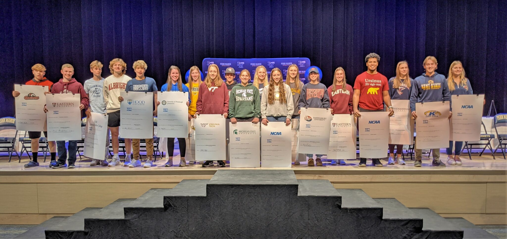 Group photo of National Signing Day student athletes.