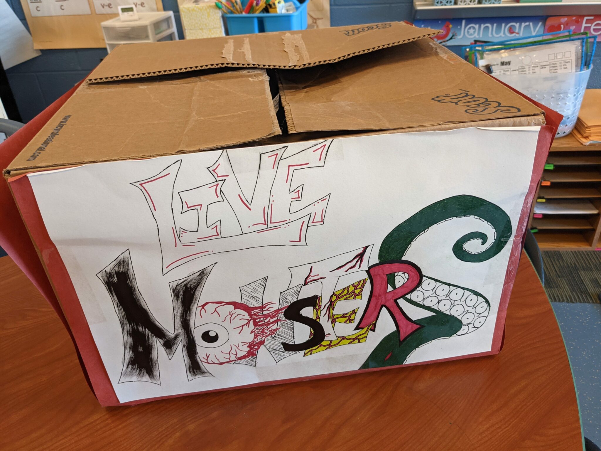 Photo of the box of monsters decorated by students.