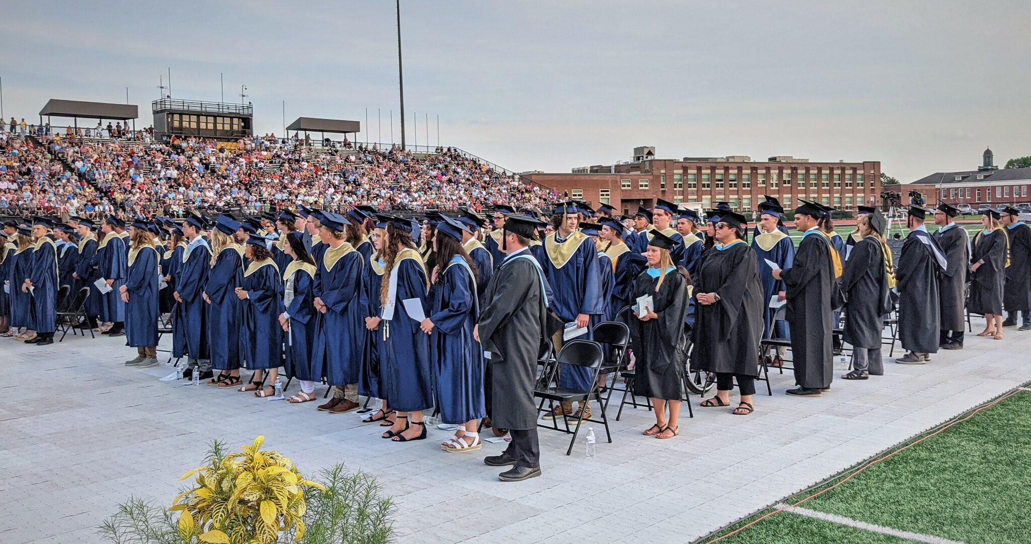 Photo of the graduates on the field.