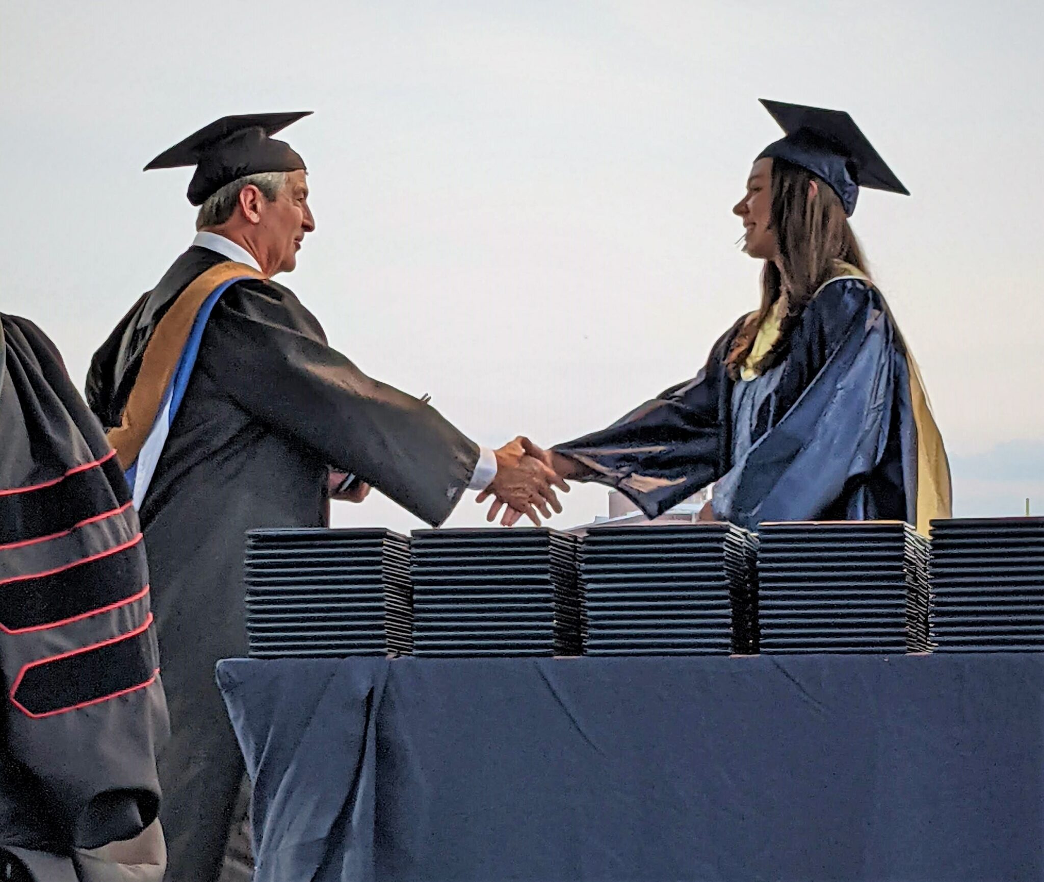 Photo of a student receiving her diploma