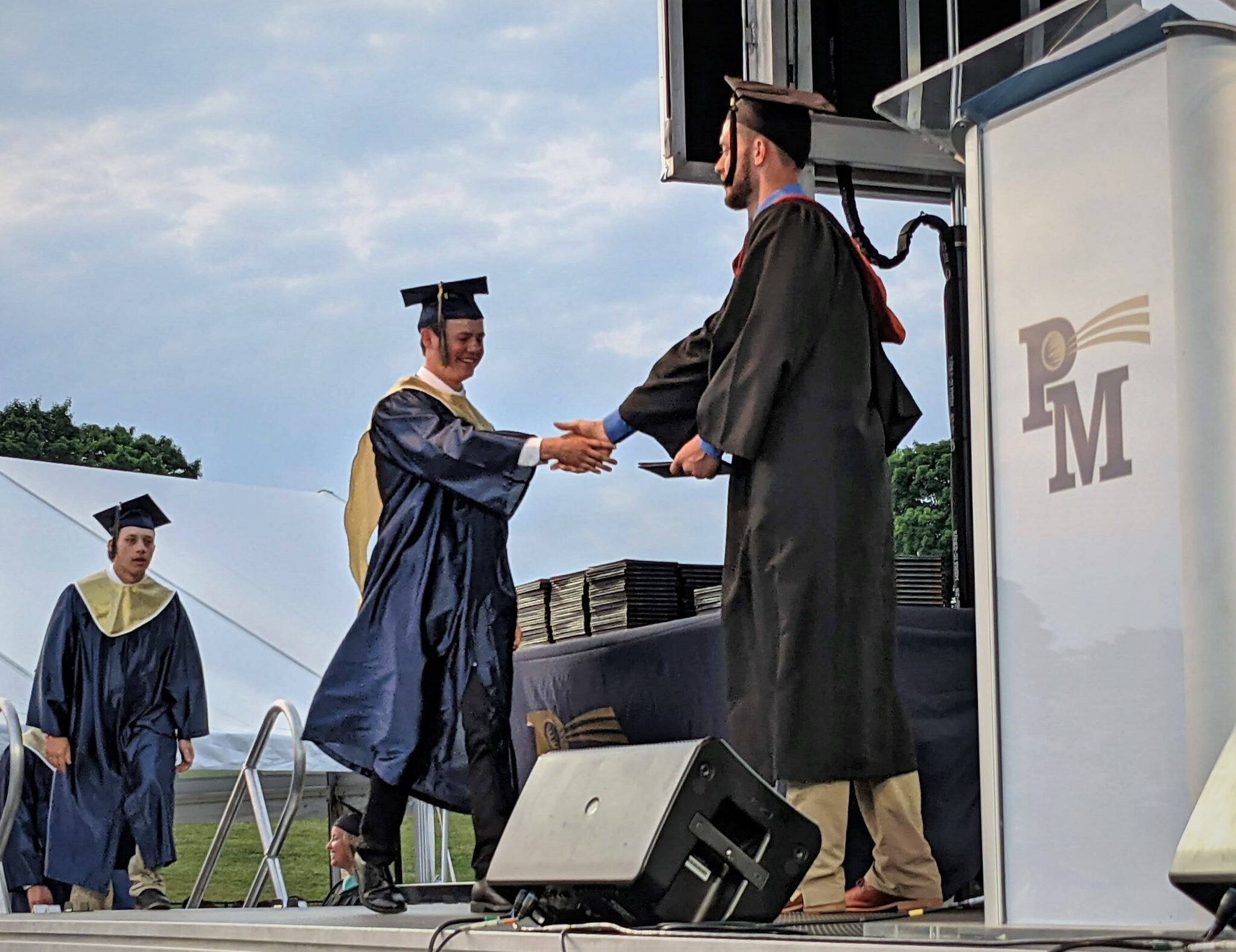 Photo of a student receiving his diploma