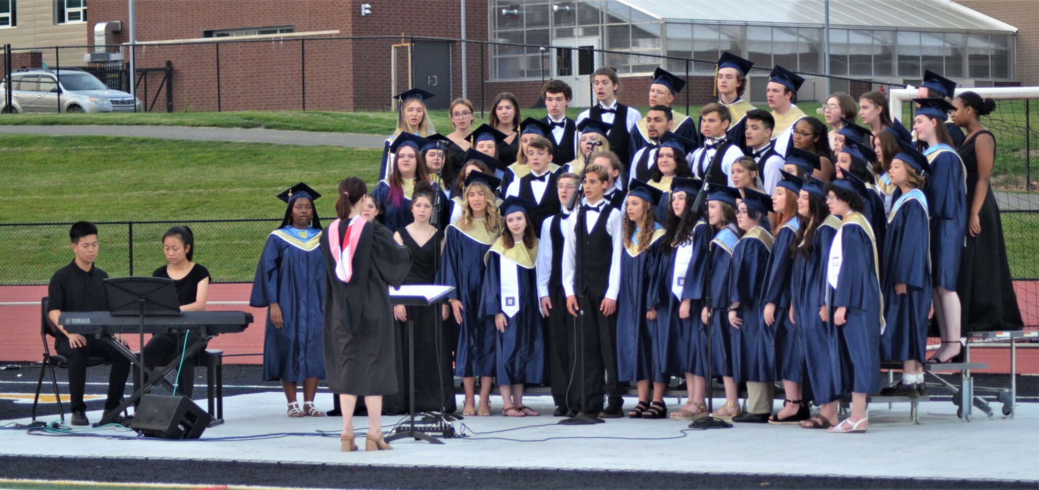 Photo of chorus members performing.