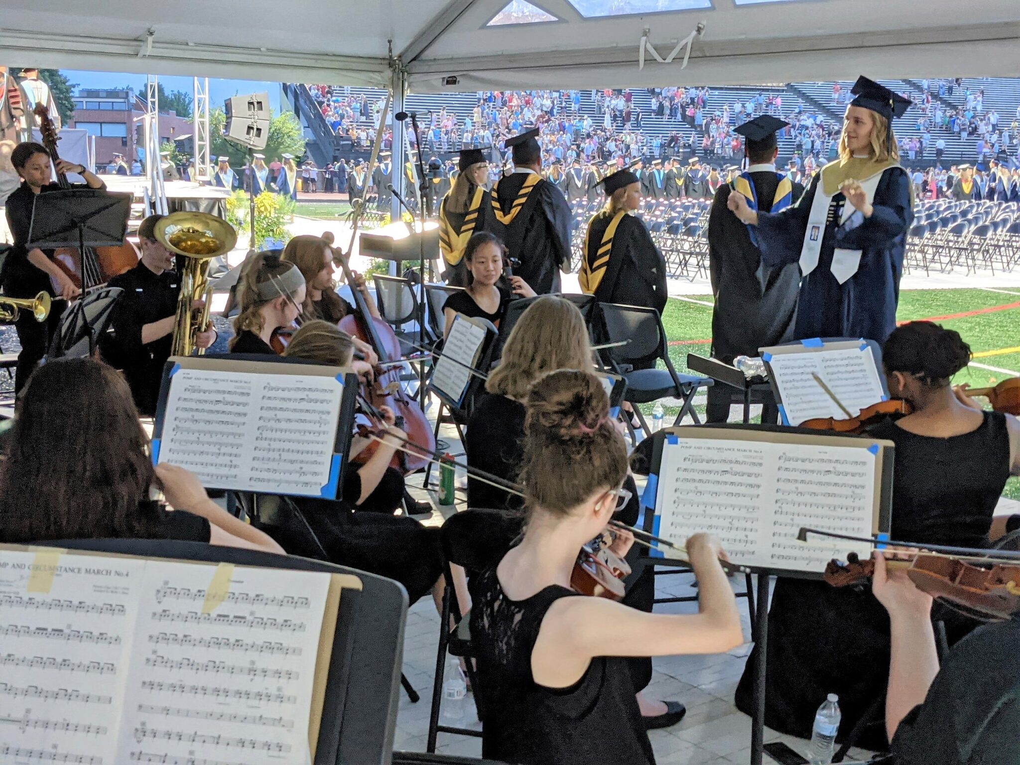 Photo of orchestra members performing.