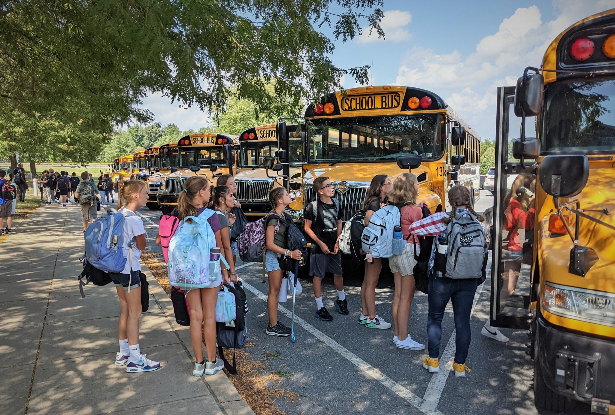 Photo of students getting on bus at Manor Middle School