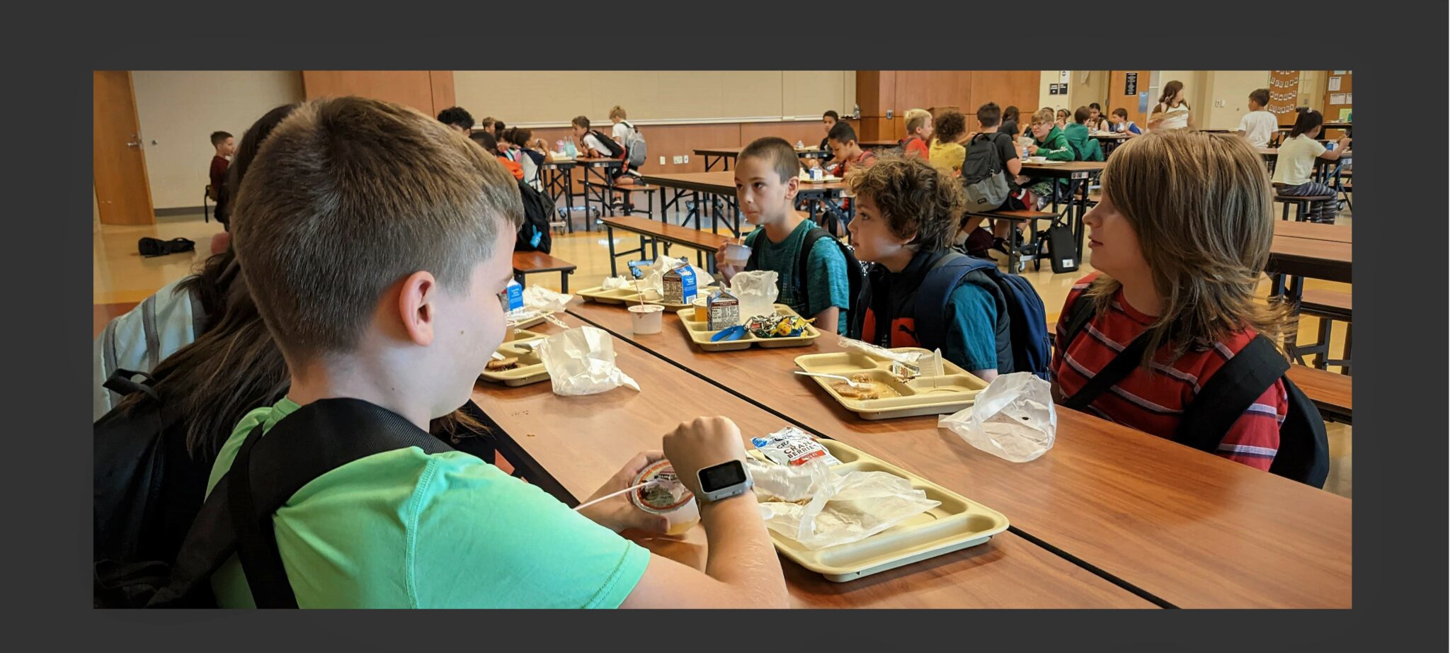 Photo of students eating breakfast