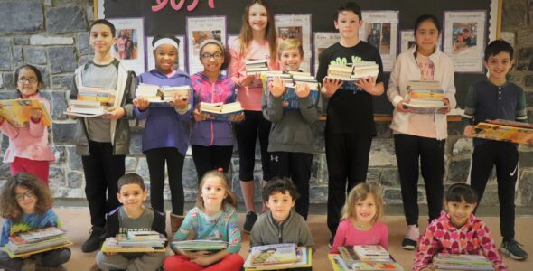 Students of different ages holding books