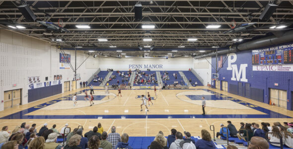 High school gymnasium filled with people.