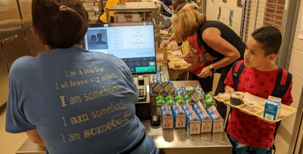 student buying food in cafeteria