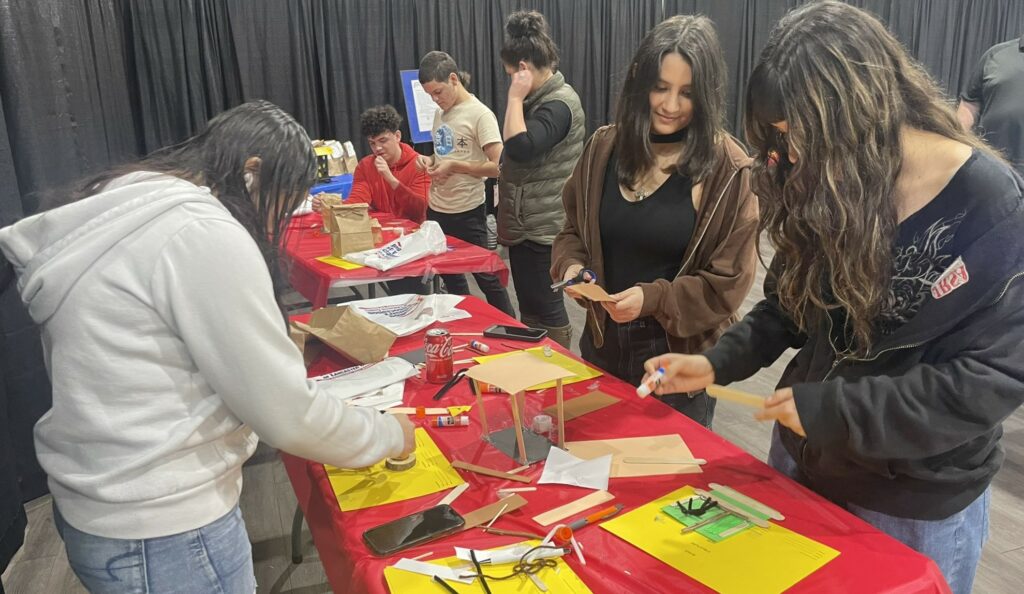 High school students participating in a STEM activity