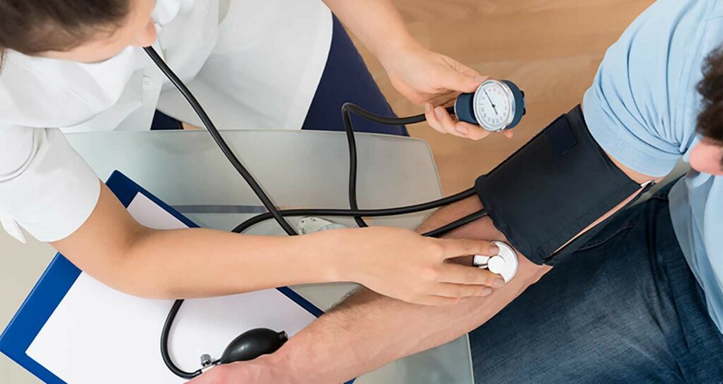 Nurse checking a student's blood pressure