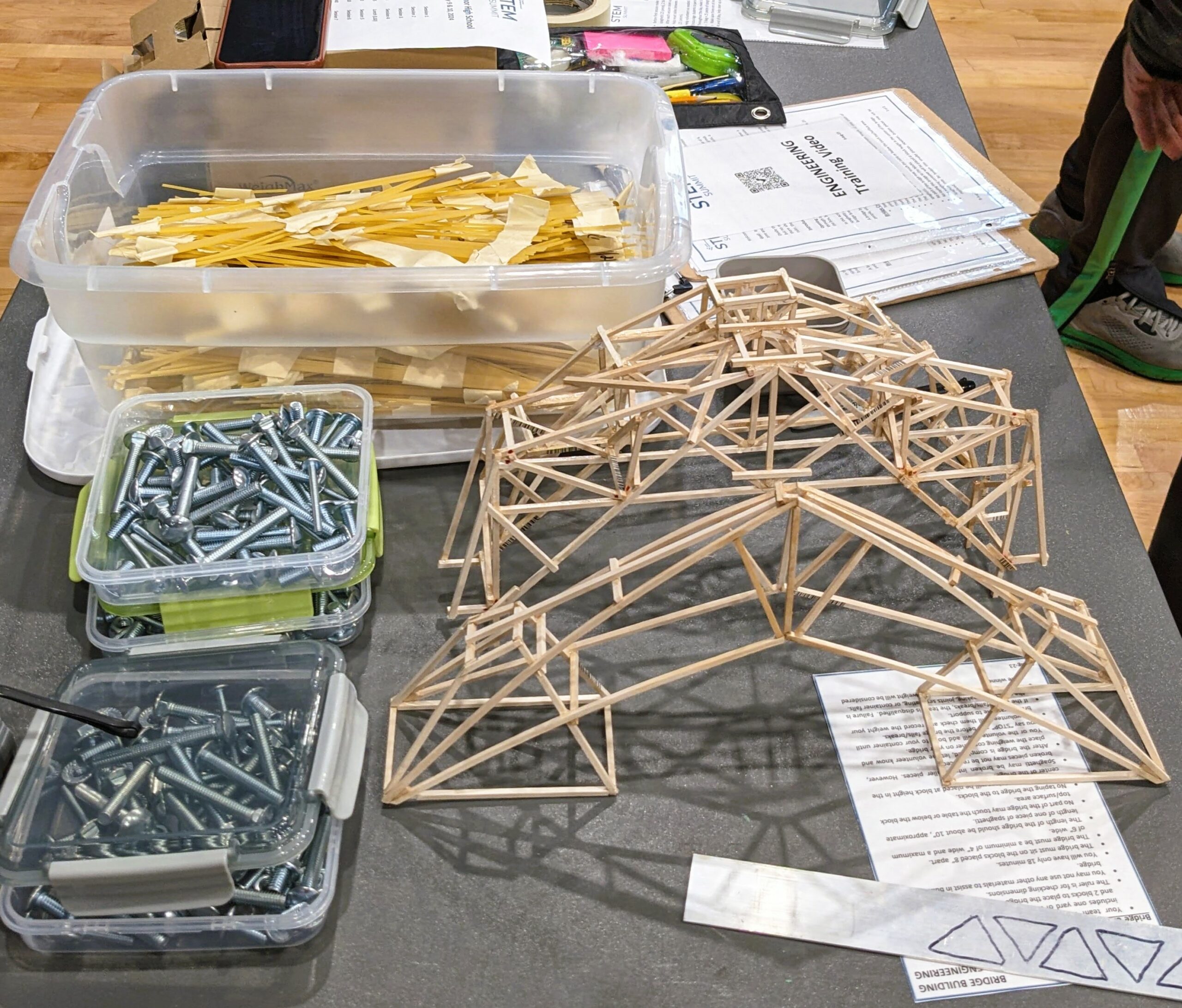 Spaghetti, bolts and bridge designs used in an engineering exercise.