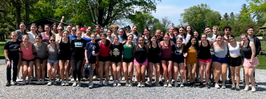 Sixty-one students pose for a group photo at Long's Park