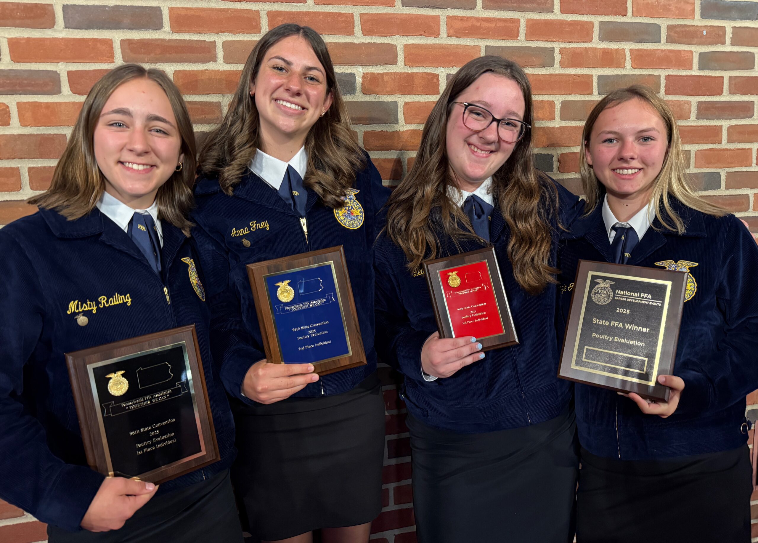 Four Poultry Evaluation Team members.