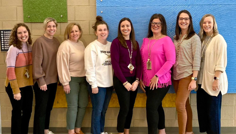 Hambright Teachers standing in the building